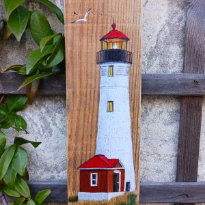 Phare à tête rouge et sa maison